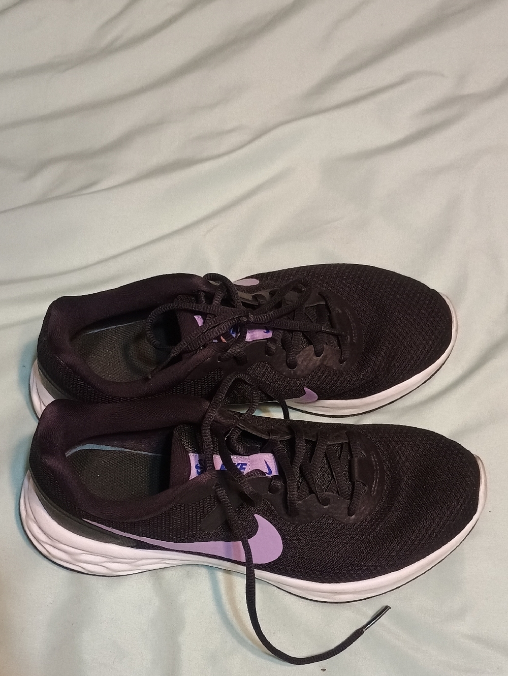 Nike Women's Black Athletic Shoes with Purple Swoosh